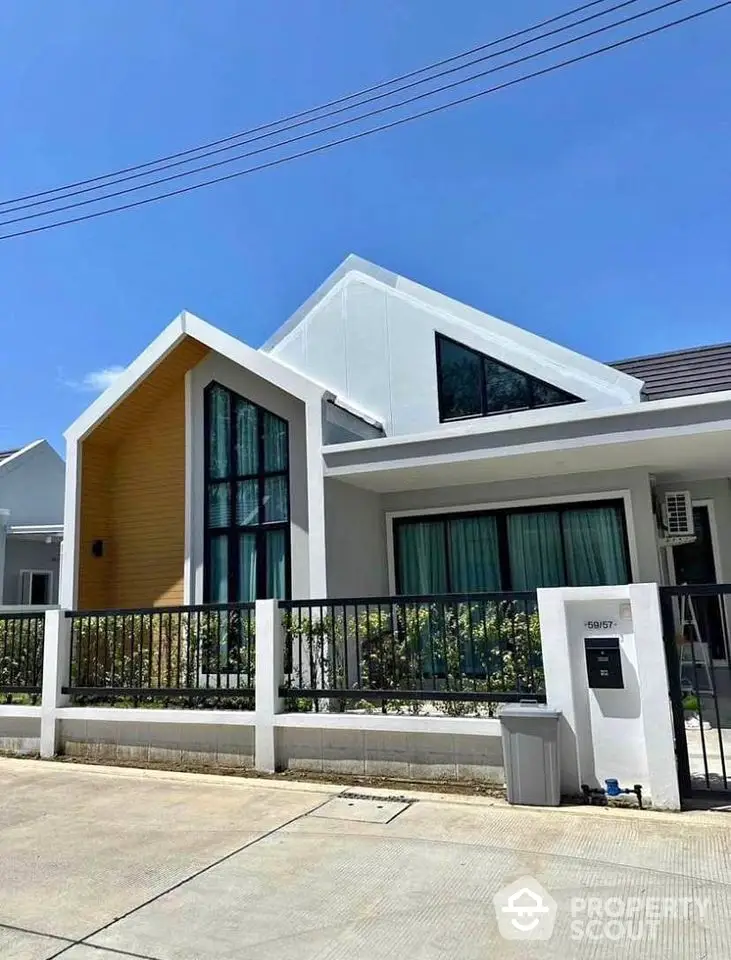 Modern single-story house with unique architecture and large windows