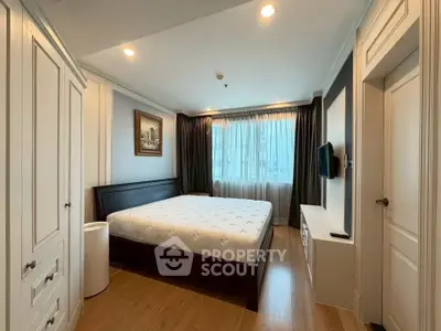 Spacious bedroom with elegant decor and natural light