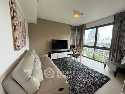 Modern living room with plush sofa, stylish decor, and city view