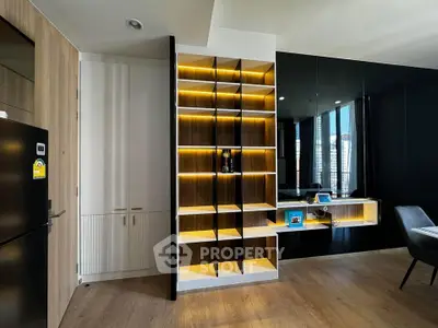 Modern living room with stylish shelving and sleek black accents