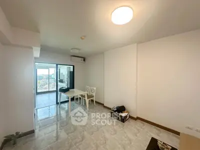 Spacious modern living room with tiled flooring and balcony access in a bright apartment.