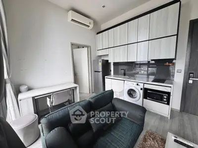 Modern compact living room with integrated kitchen and appliances