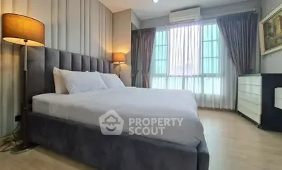 Luxurious bedroom with elegant decor and natural light