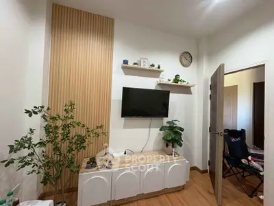 Modern living room with wall-mounted TV and stylish decor