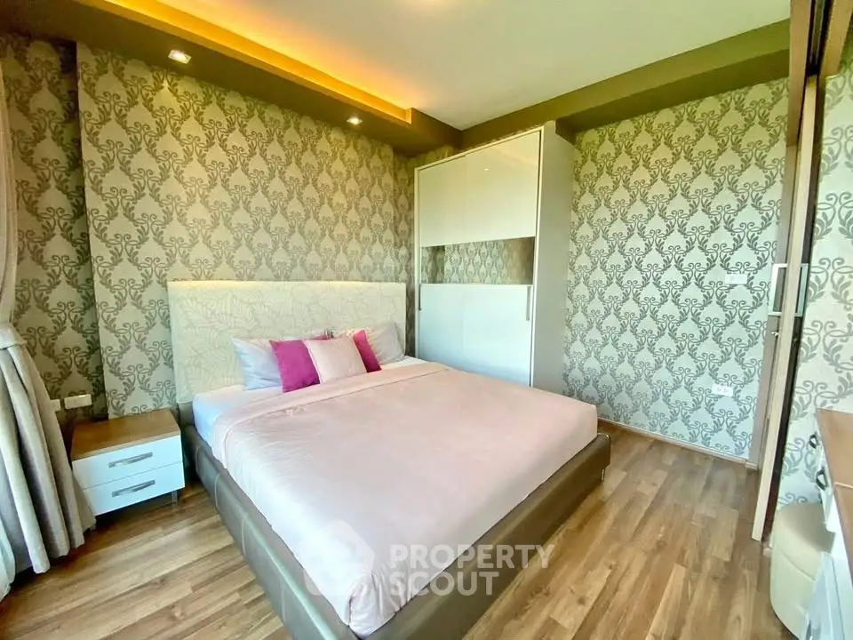 Stylish bedroom with elegant wallpaper and modern furnishings