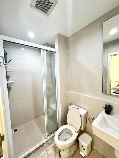 Modern bathroom with sleek shower enclosure and minimalist design