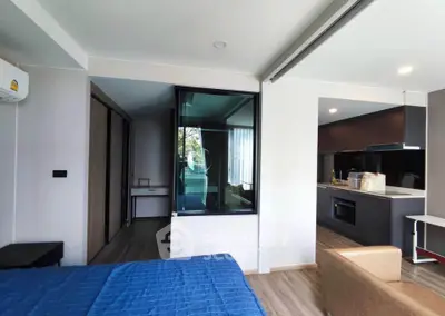 Modern studio apartment with open kitchen and cozy living area