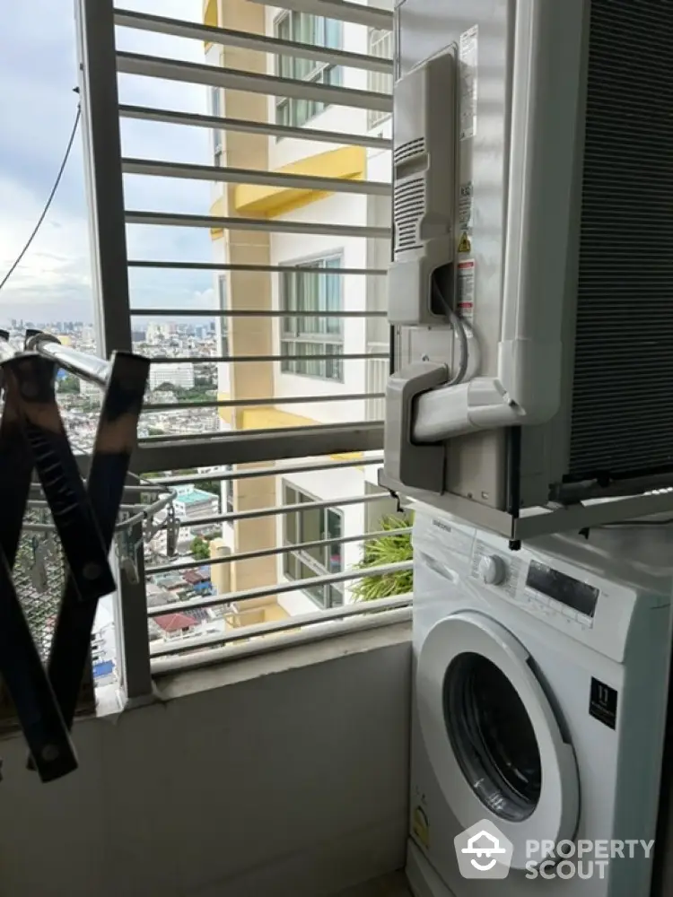 Modern apartment balcony with washing machine and city view