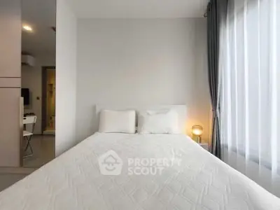 Cozy bedroom with natural light and modern decor