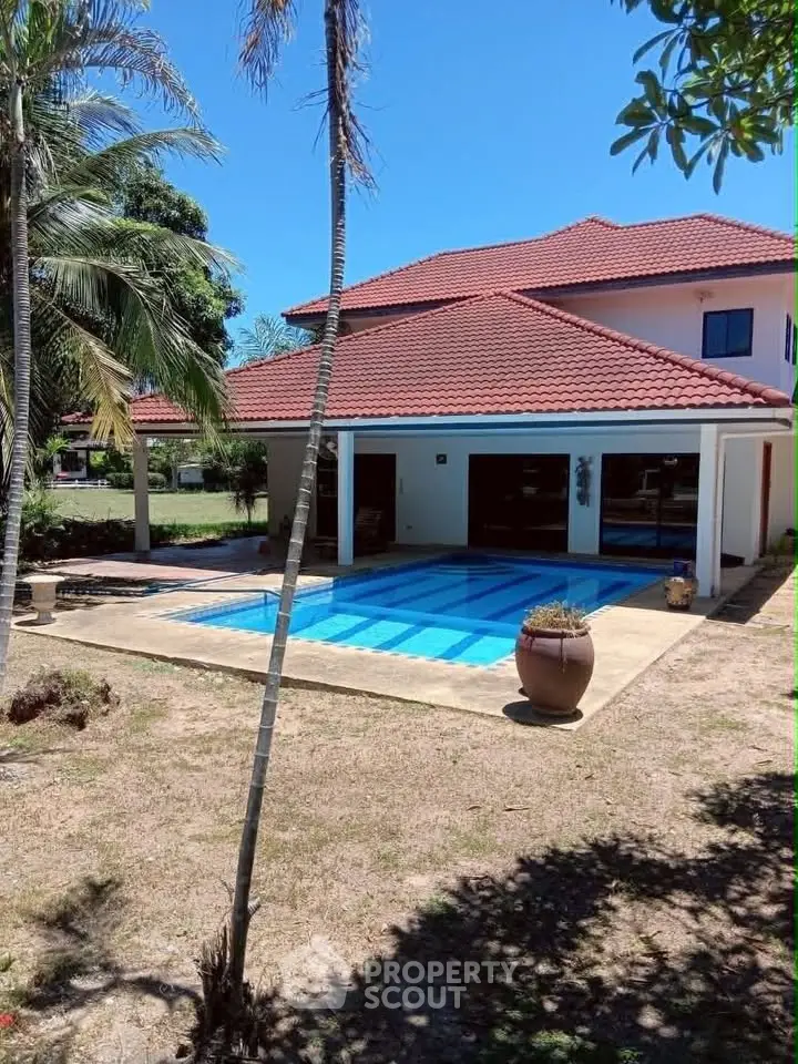 Stunning villa with private pool and lush garden, perfect for luxury living.