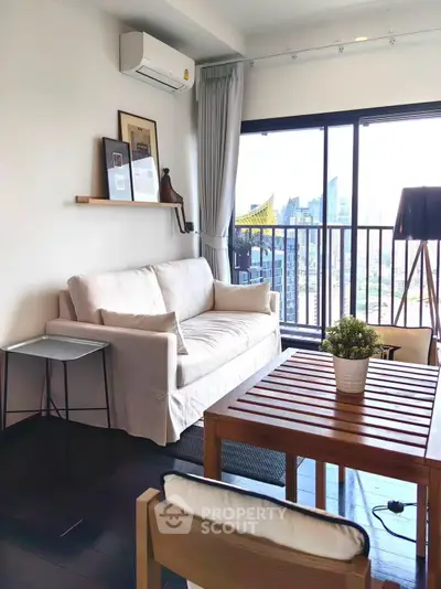 Modern living room with city view, featuring cozy sofa and stylish decor, perfect for urban living.
