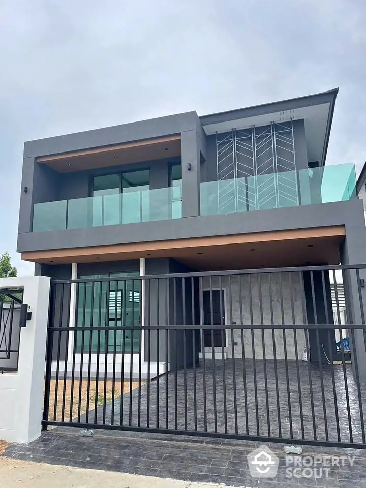 Modern two-story house with sleek design and spacious balcony