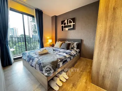 Modern bedroom with stylish decor and balcony view in urban apartment