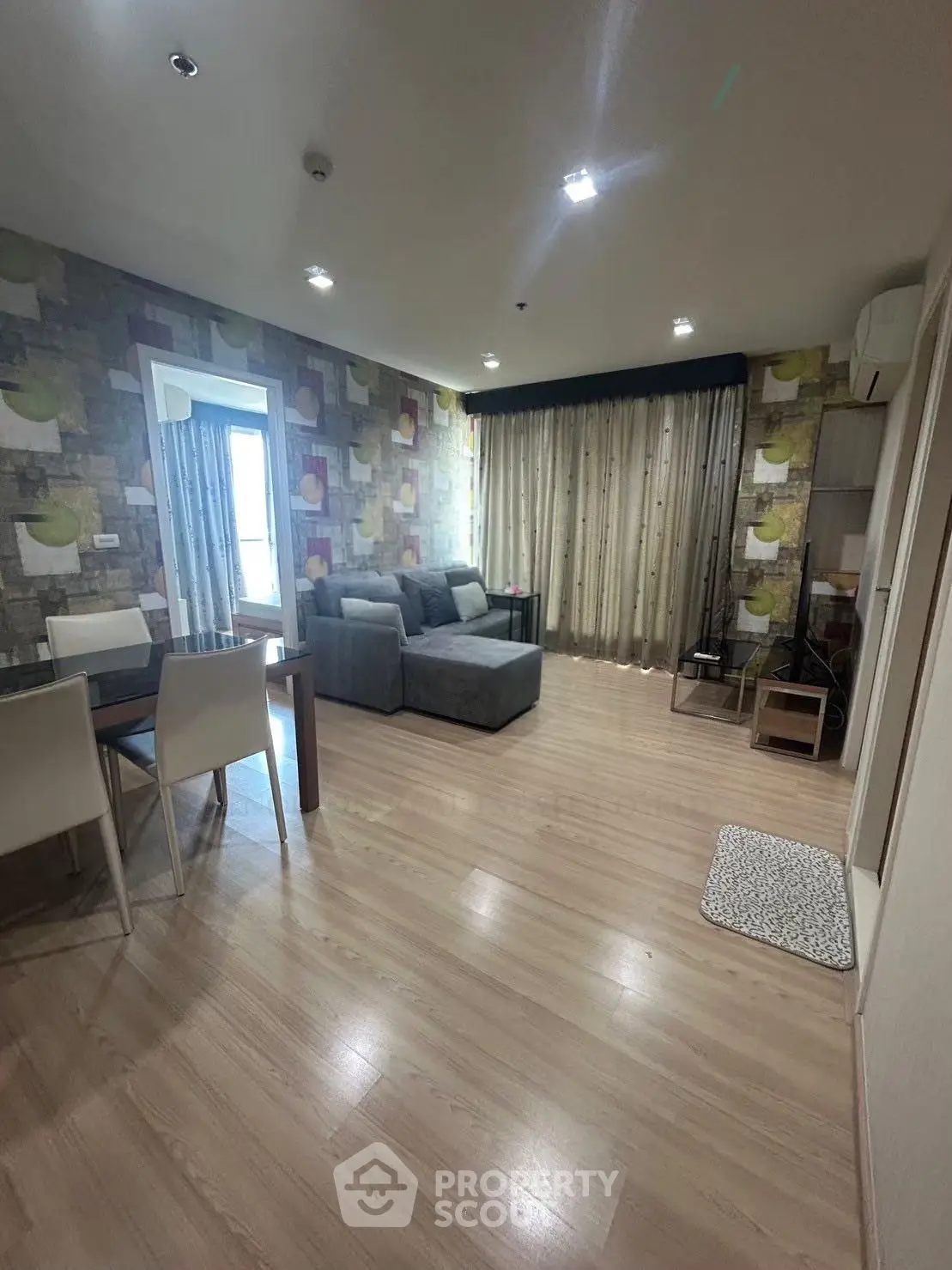 Spacious living room with modern decor and large windows for natural light.