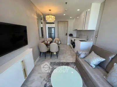 Modern living room with elegant dining area and compact kitchen in luxury apartment.