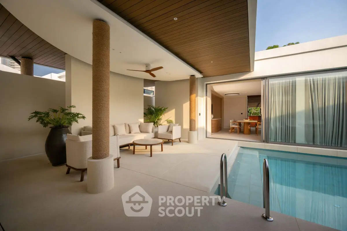 Luxurious modern poolside patio with elegant seating and serene ambiance.