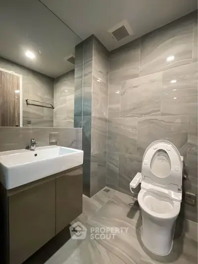 Modern bathroom with sleek fixtures and elegant tile design