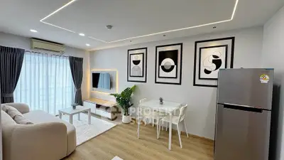 Modern living room with stylish decor, cozy seating, and sleek dining area in open layout apartment.