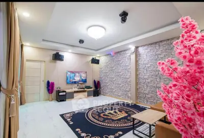 Spacious living room with modern decor and stylish stone accent wall