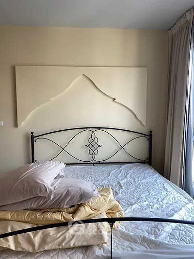 Cozy bedroom with artistic wall decor and natural light