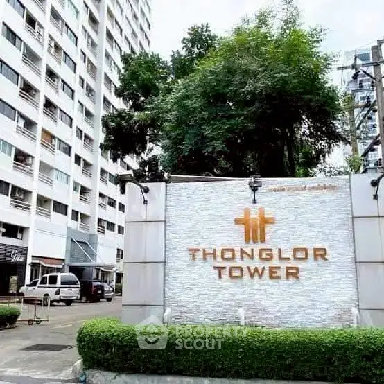 Thonglor Tower entrance with lush greenery and modern facade