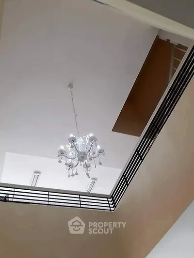 Elegant interior ceiling view with modern chandelier in a stylish home