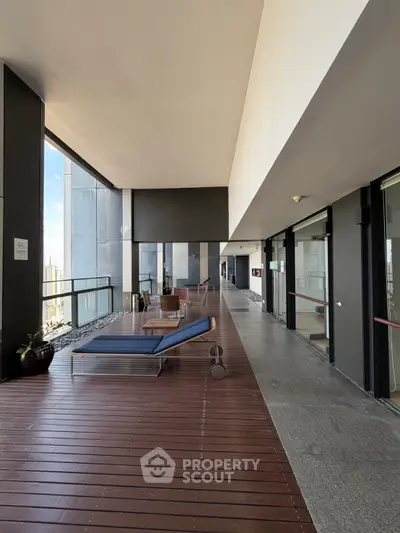 Luxurious balcony with modern lounge chairs and stunning city view