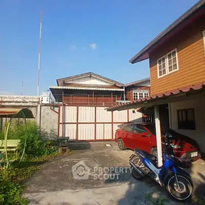 Charming residential property with spacious driveway and traditional architecture, perfect for family living.