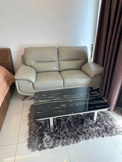 Modern living room with stylish sofa and sleek coffee table on plush rug