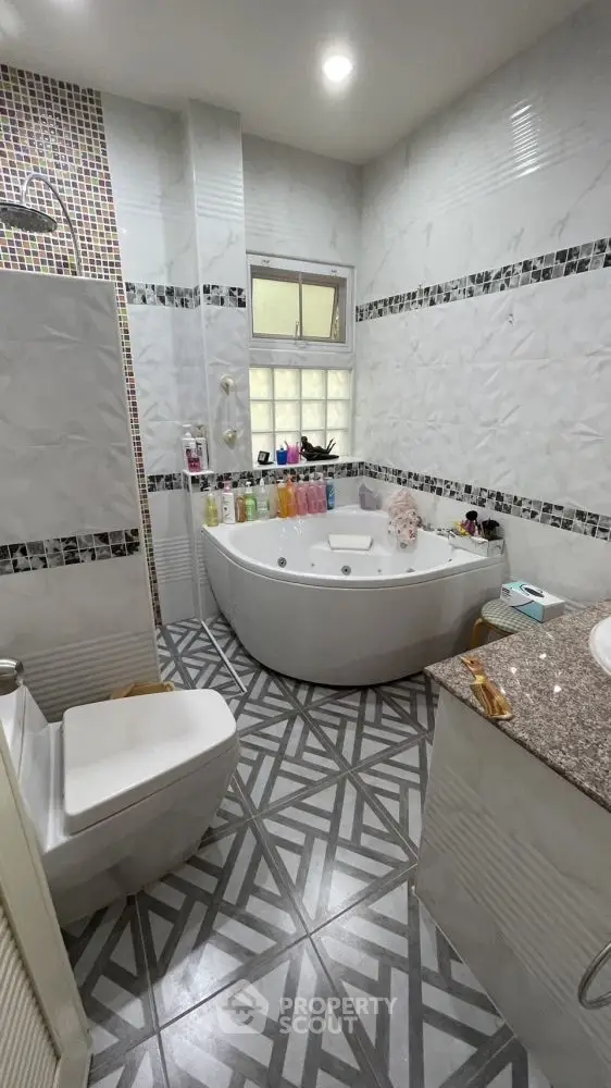 Luxurious bathroom with modern jacuzzi and stylish tile design