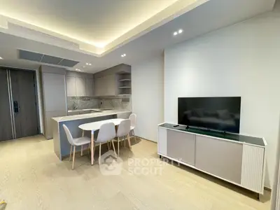 Modern open-plan living room with sleek kitchen and dining area