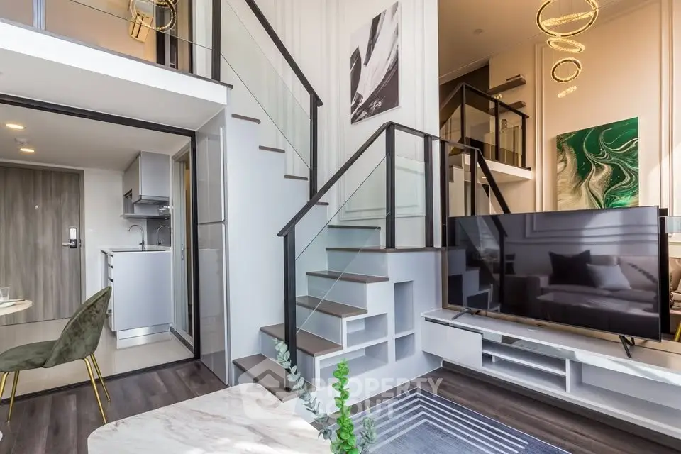 Modern duplex living room with stylish decor and open kitchen layout