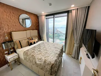 Luxurious bedroom with stunning city view, elegant decor, and modern amenities in high-rise apartment.