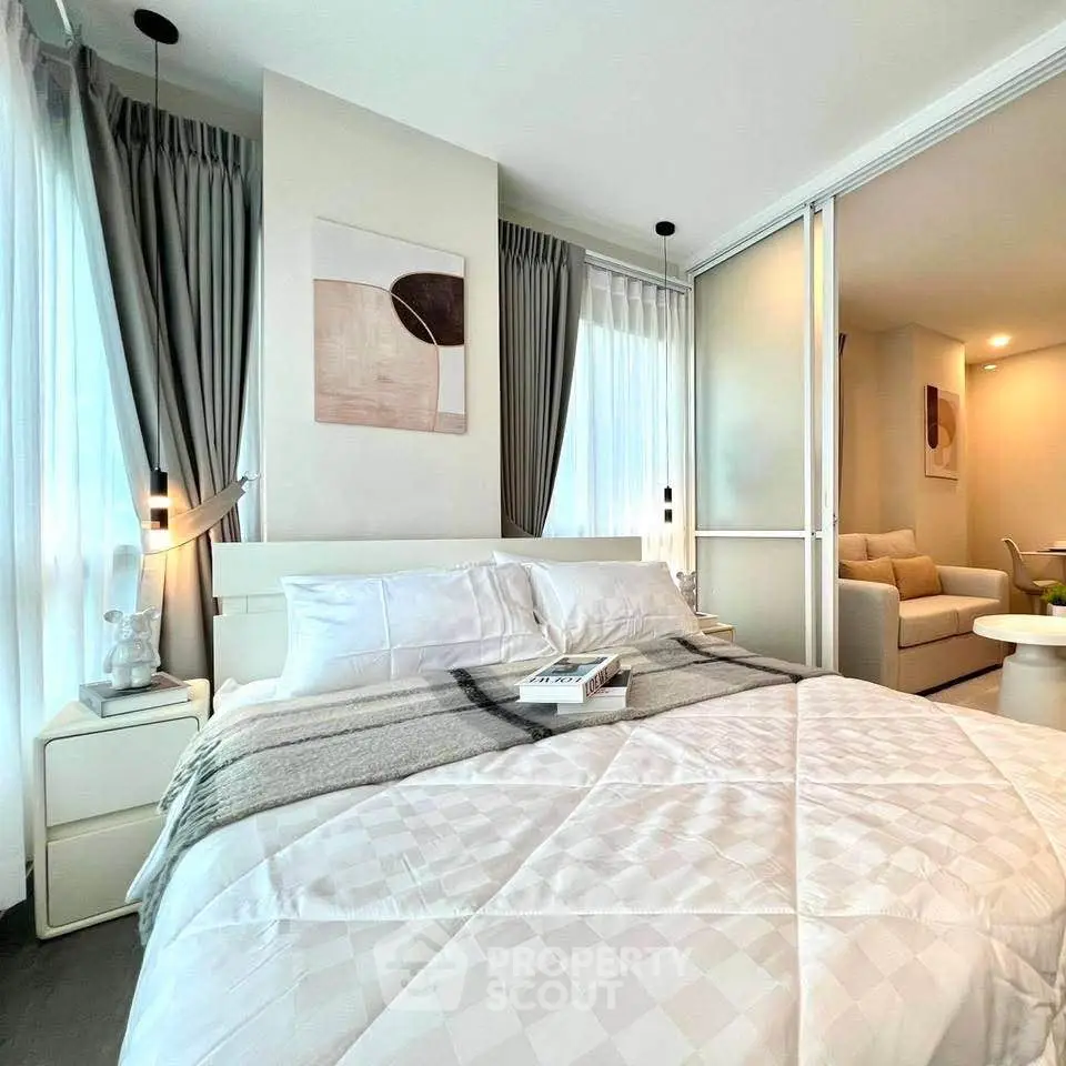 Modern bedroom with elegant decor and cozy ambiance, featuring a comfortable bed and stylish furnishings.