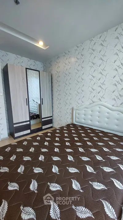 Modern bedroom with stylish wardrobe and elegant bed in a chic apartment.