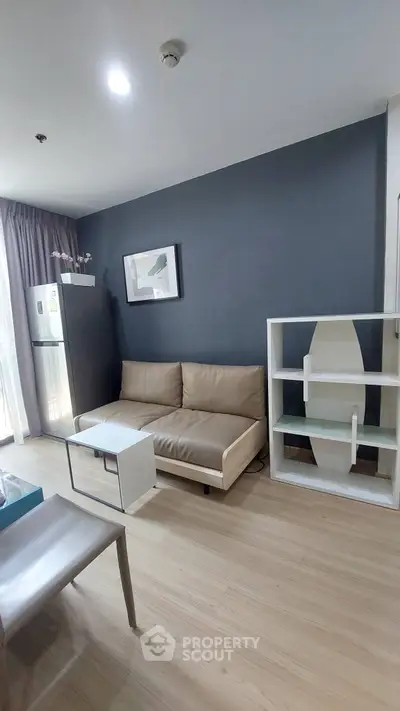 Modern living room with sleek furniture and stylish decor in a contemporary apartment.