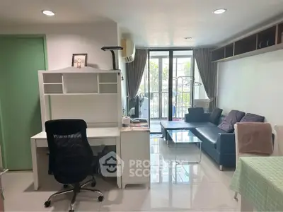Modern living room with study area and balcony view, featuring sleek furniture and natural light.