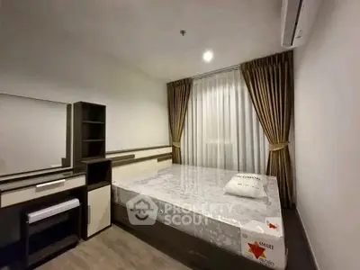 Modern bedroom with stylish furniture and elegant curtains in a cozy apartment.