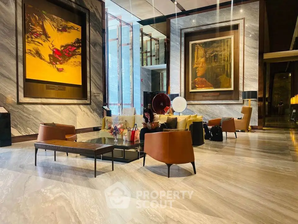 Luxurious lobby with modern art and elegant seating in upscale building