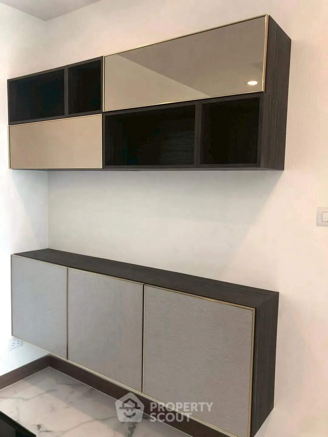 Modern wall-mounted storage cabinets with sleek design and neutral colors in a contemporary interior.