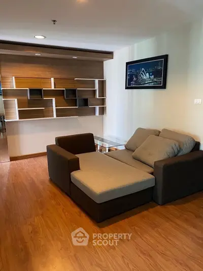 Modern living room with stylish shelving and cozy sofa