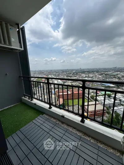 Stunning high-rise balcony with panoramic city views and modern railing design.