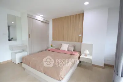 Modern bedroom with stylish wood paneling and cozy lighting