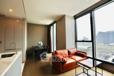 Modern living room with large windows and city view, featuring a cozy orange sofa and dining area.