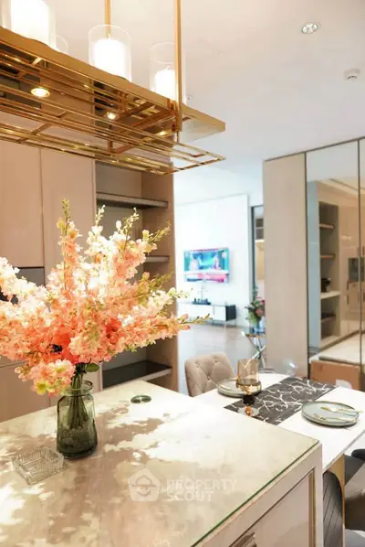 Luxurious open-plan kitchen with elegant decor and modern lighting