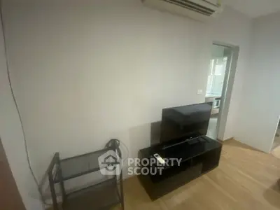 Cozy interior with air conditioning and modern TV stand in a minimalist room.