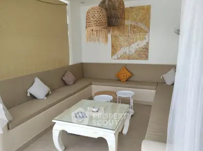 Chic and cozy living room with modern decor and natural lighting, perfect for relaxation and entertaining.