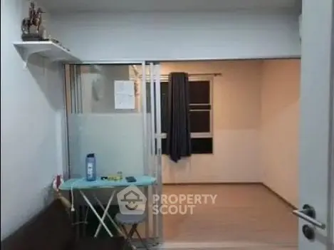 Cozy apartment interior with sliding glass doors and minimalist decor