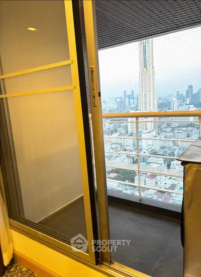 Stunning high-rise balcony with panoramic city views, perfect for urban living.