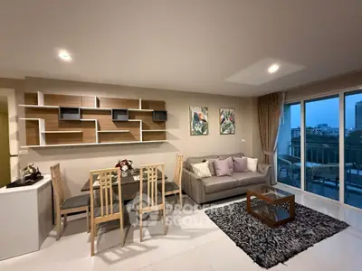 Spacious modern living room with elegant decor and city view balcony